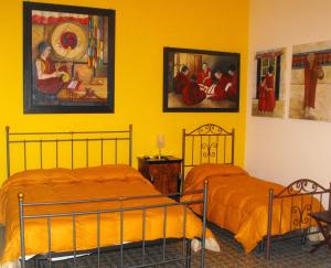 A bed or beds in a room at B&B Casa Degli Artisti