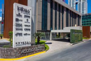 a building with a sign in front of it at Krystal Urban Monterrey San Jeronimo in Monterrey