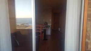 Kuchyň nebo kuchyňský kout v ubytování Habitaciones y Apartamentos el Caleuche El Tabo