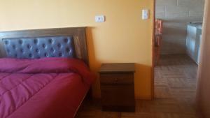 Postel nebo postele na pokoji v ubytování Habitaciones y Apartamentos el Caleuche El Tabo