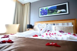 Postel nebo postele na pokoji v ubytování Tenera Hotel