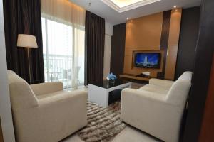TV a/nebo společenská místnost v ubytování Tenera Hotel