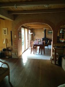 a dining room with a table and chairs in a room at gite des 3 cazelles in Cajarc