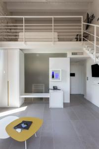 TV in/ali zabaviščno središče v nastanitvi Caportigia Boutique Hotel