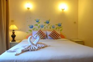 Postel nebo postele na pokoji v ubytování Phurua Bussaba Resort & Spa