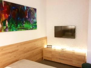 TV a/nebo společenská místnost v ubytování ATRIUM 24 Studio