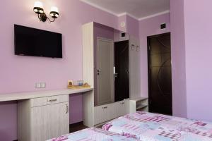 Postel nebo postele na pokoji v ubytování Kirios Hotel