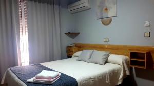 Postel nebo postele na pokoji v ubytování Hotel Alaska