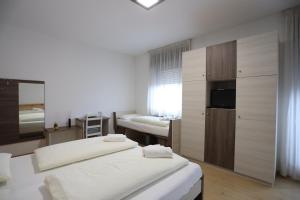 Posteľ alebo postele v izbe v ubytovaní Albergo Bellaria