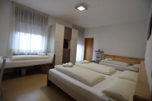 Posteľ alebo postele v izbe v ubytovaní Albergo Bellaria