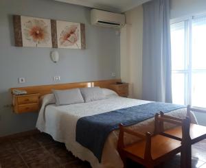 Postel nebo postele na pokoji v ubytování Hotel Alaska