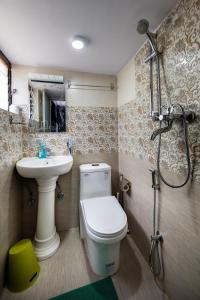 a bathroom with a toilet and a sink and a shower at Inn Sangrahalaya in Bhaktapur