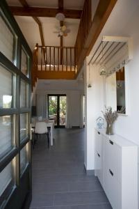 a hallway with a staircase in a house at Studio apartman - MELLITUS in Molat +4 photos