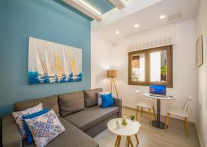 a living room with a couch and a table at Aretousa Suites in Chania Town