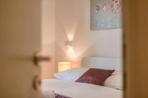 Postel nebo postele na pokoji v ubytování Apartments Lea