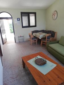 a living room with a couch and a table at Apartment Bonita in Vir