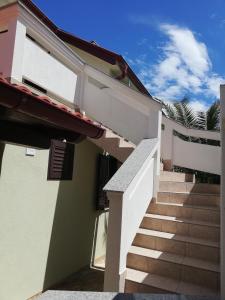 a stairway leading up to a building with a stair case at Apartment Bonita in Vir