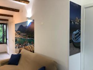 a living room with a couch and a picture on the wall at Scopello Guidaloca Villas in Scopello