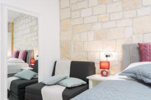 Posteľ alebo postele v izbe v ubytovaní Apartman Arbol