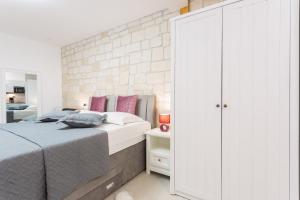 Posteľ alebo postele v izbe v ubytovaní Apartman Arbol