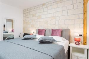Posteľ alebo postele v izbe v ubytovaní Apartman Arbol