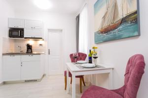 Kuchyňa alebo kuchynka v ubytovaní Apartman Arbol