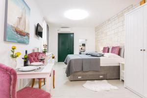 Posteľ alebo postele v izbe v ubytovaní Apartman Arbol