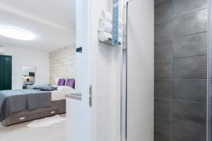 Posteľ alebo postele v izbe v ubytovaní Apartman Arbol