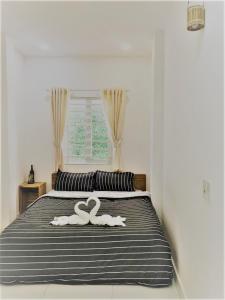 Giường trong phòng chung tại H Best Hostel Cafe SaiGon