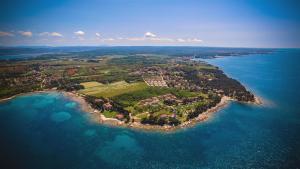 an aerial view of an island in the water at Hotel La Settima Luna in Savudrija
