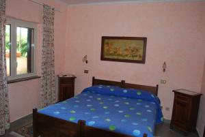 A bed or beds in a room at Agriturismo La Valle Di Ceri