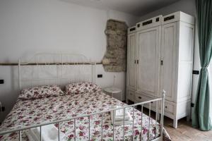 Posteľ alebo postele v izbe v ubytovaní Massignano 116 + 11 fotografií