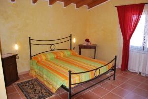 A bed or beds in a room at Agriturismo La Valle Di Ceri