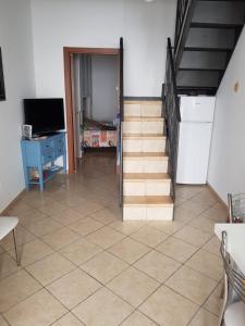 Televízia a/alebo spoločenská miestnosť v ubytovaní Villa Amalfi