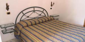 Postel nebo postele na pokoji v ubytování Villaggio "Camping Pompei" Bungalow