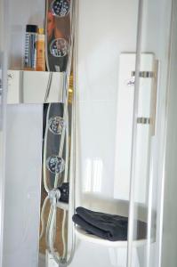 a shelf with a mirror in a bathroom at 33 Paveestraße in Eupen