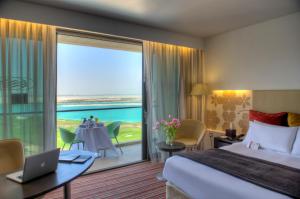 a hotel room with a view of the ocean at Crowne Plaza Yas Island, an IHG Hotel in Abu Dhabi