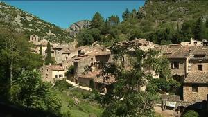 a group of houses in a village on a hill at La belle étape in Sérignan +11 photos