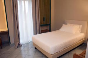 Postel nebo postele na pokoji v ubytování Hotel Commercio