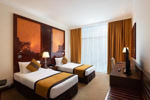 Voodi või voodid majutusasutuse Landmark Premier Hotel toas