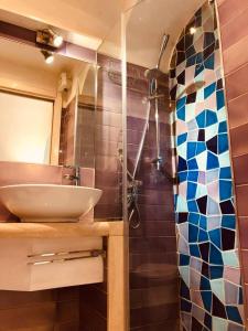 a bathroom with a sink and a shower at A casa dei Sasso, Laetitia Suite in Positano