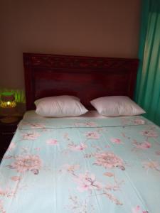 מיטה או מיטות בחדר ב-Chez Coumba et Daniel