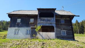 an old barn sitting on top of a hill at Kloiberhof in Öblarn +11 photos