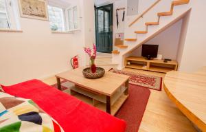 a living room with a couch and a table at Apartment Sorta in Dubrovnik