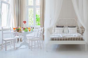 Posteľ alebo postele v izbe v ubytovaní Riviera Residence Apartments