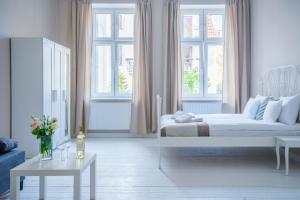 Posteľ alebo postele v izbe v ubytovaní Riviera Residence Apartments