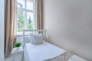 Posteľ alebo postele v izbe v ubytovaní Riviera Residence Apartments