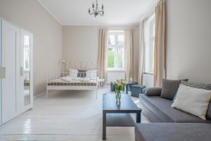 Posteľ alebo postele v izbe v ubytovaní Riviera Residence Apartments