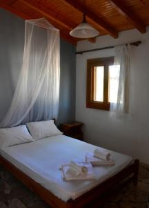 Postel nebo postele na pokoji v ubytování Poseidon Apartments + 36 fotografií