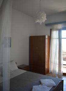 Postel nebo postele na pokoji v ubytování Poseidon Apartments